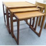 A nesting set three 1970s teak occasional tables, raised on splayed end supports  largest 19"h  21"w