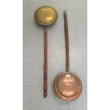An early 19thC copper and brass warming pan with a scratch engraved design on the lid, on a turned