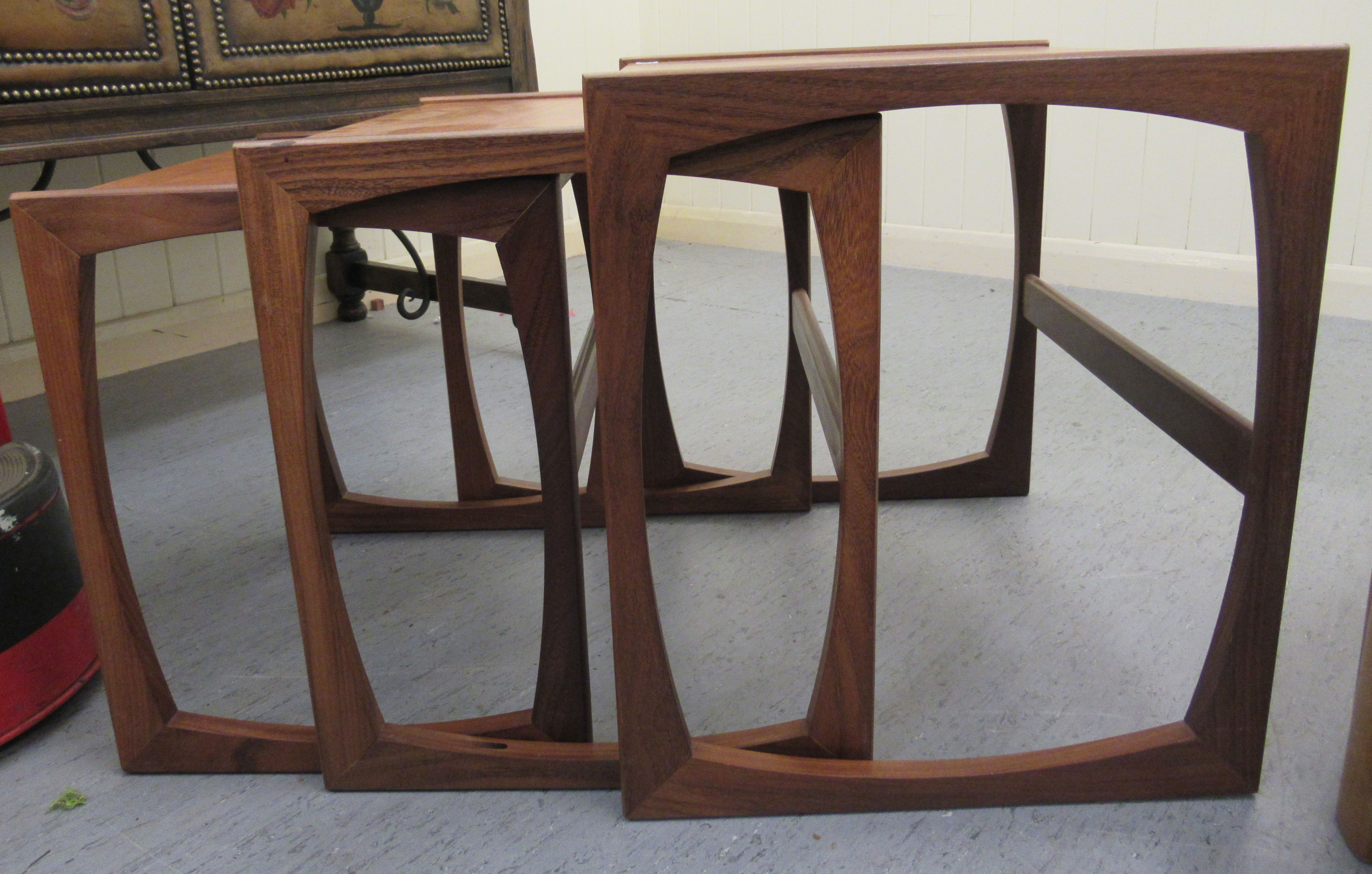 A nesting set three 1970s teak occasional tables, raised on splayed end supports  largest 19"h  21"w - Image 2 of 5