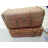An early 20thC moulded and stitched brown hide trunk with buckled straps  13"h  36"w; and a