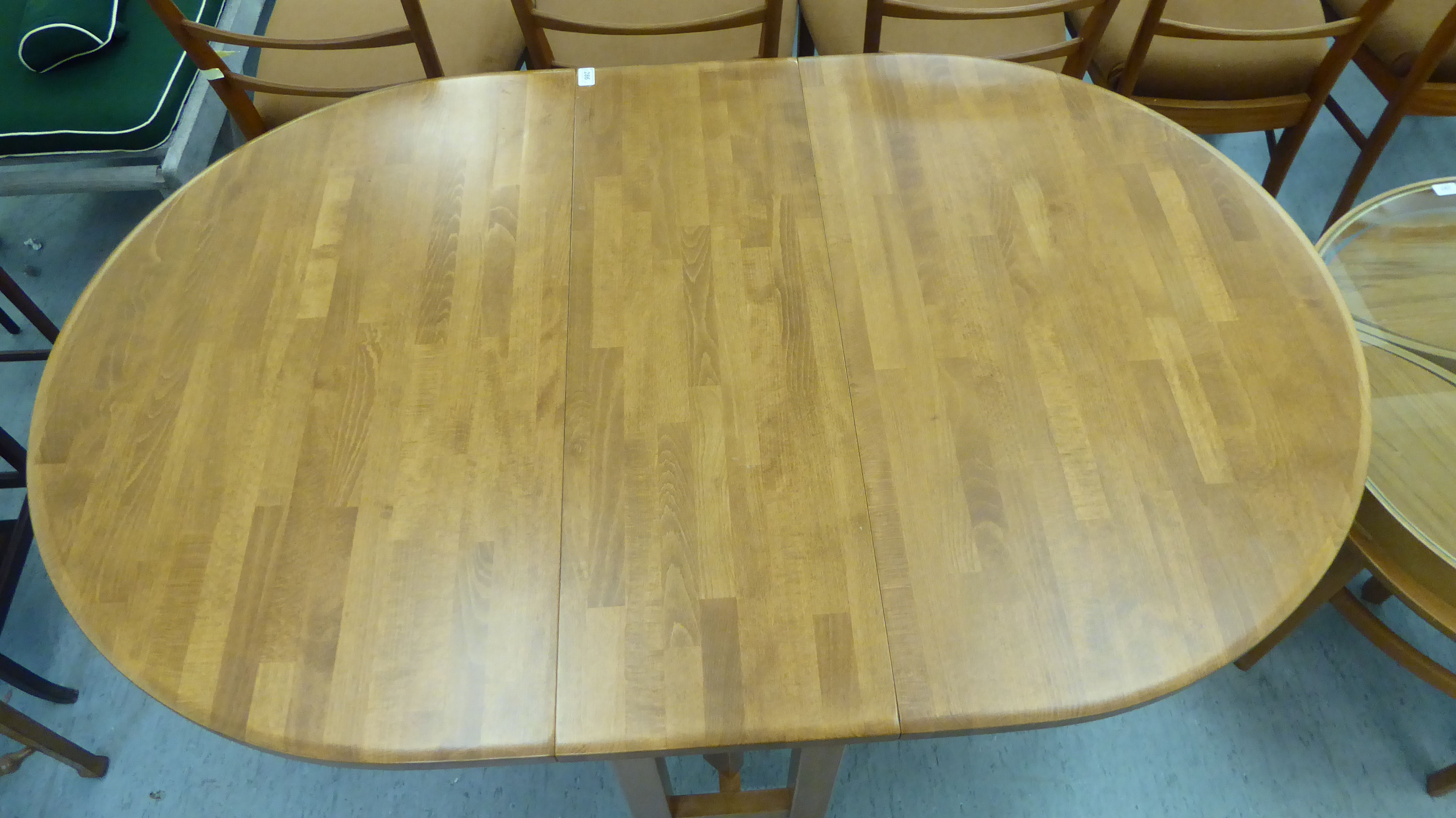A modern stained beech drop leaf breakfast table  29"h  36"w  46"L open - Image 2 of 3