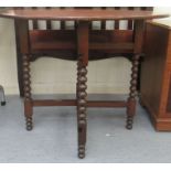 An early 20thC mahogany folding gateleg table, the oval top raised on barleytwist and block legs