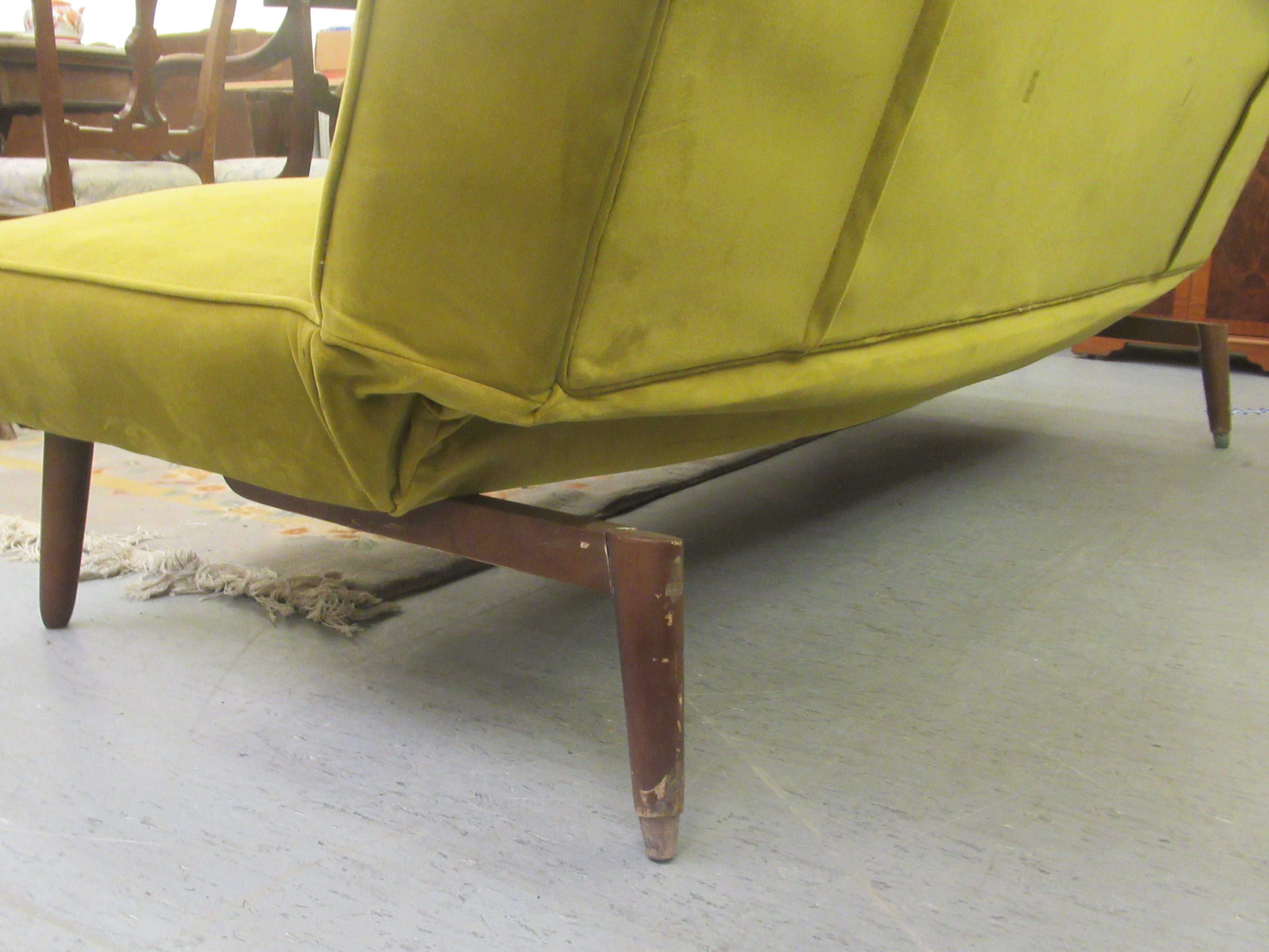 A vintage style lime green button upholstered four person settee, raised on teak tapered legs - Image 5 of 5