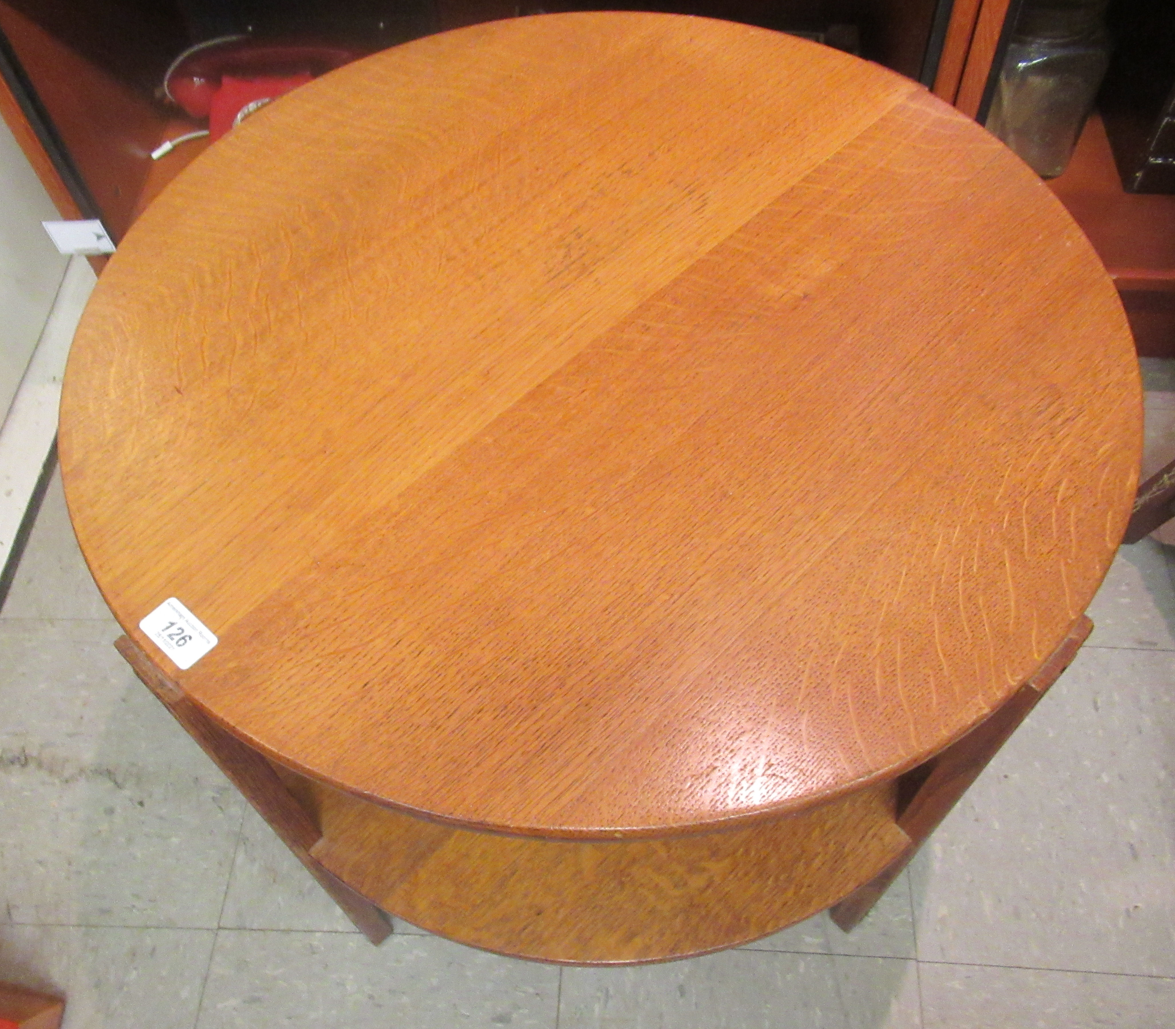 A 1920s oak two tier occasional table, raised on block legs  20"h  24"dia - Image 2 of 2