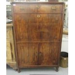 An early 19thC satinwood and ebony inlaid mahogany secretaire abattant with a top drawer, over a