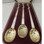 A set of three George V silver presentation serving and sifter spoon  London 1914  cased