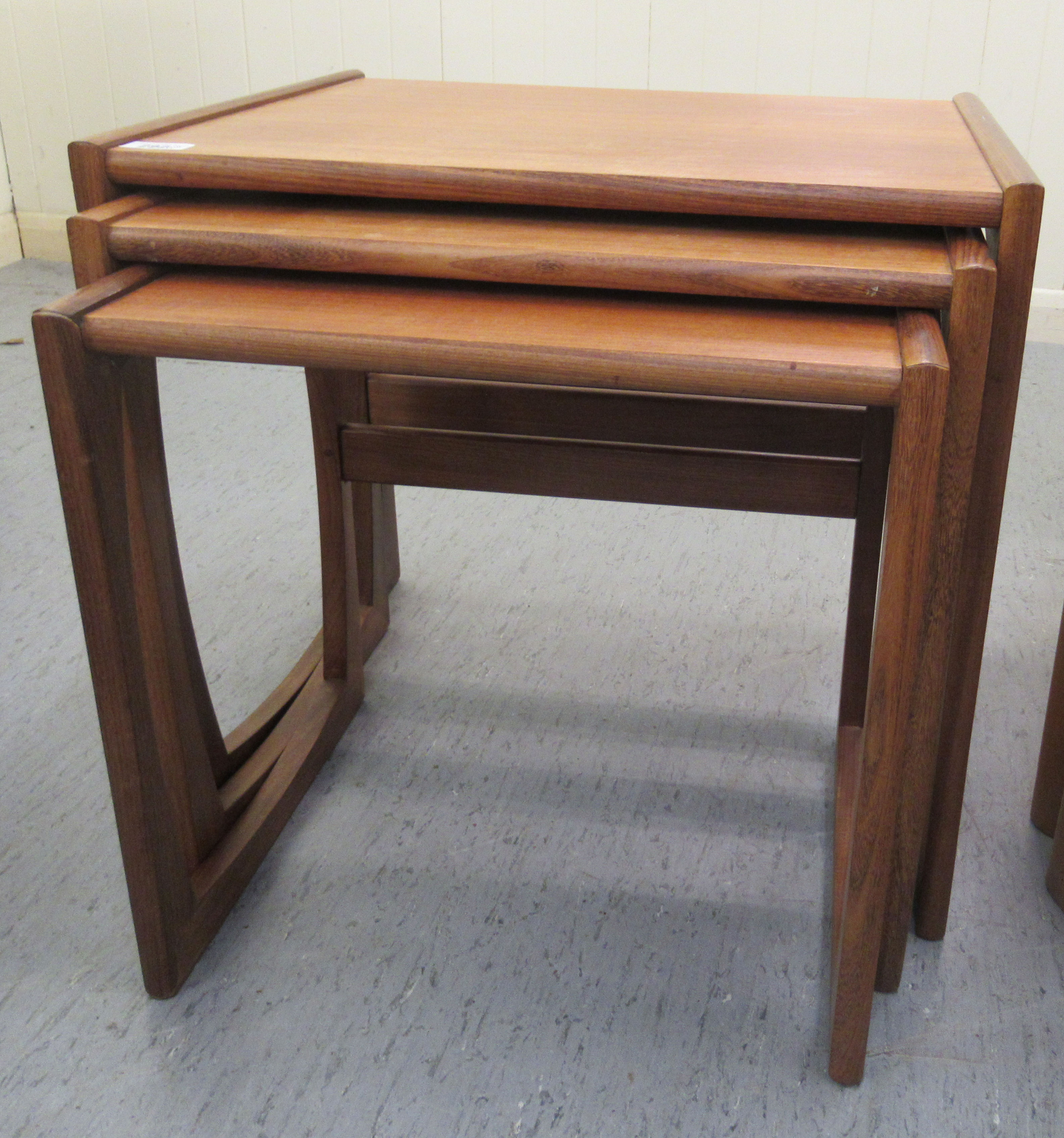 A nesting set three 1970s teak occasional tables, raised on splayed end supports  largest 19"h  21"w - Image 5 of 5