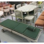 Garden furniture, viz. an oval teak table, raised on block legs  30"h  64"L 47"deep with an