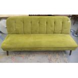 A vintage style lime green button upholstered four person settee, raised on teak tapered legs