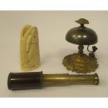 A late Victorian gilt metal and brass reception desk bell, on a cast pivotting vine base; an