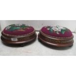 A pair of late Victorian floral tapestry topped mahogany and marquetry framed circular footstools