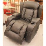 A modern electrically powered recliner armchair, upholstered in black faux hide