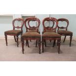 A set of six late Victorian mahogany framed balloon back dining chairs, raised on turned, tapered