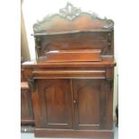 A late Victorian mahogany chiffonier with an upstand, over a frieze drawer and two panelled doors,