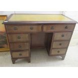 A mid 20thC ladies stained mahogany finished eight drawer, twin pedestal desk  29"h  38"w