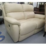 A modern cream coloured stitched hide upholstered, two person, electrically operated settee  54"w