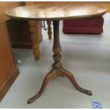 A George III mahogany pedestal table, the tip-top raised on a splayed tripod base  29"h  26"dia