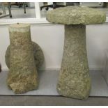 A pair of composition two part saddle stones  29"h  17"dia