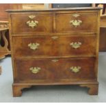 A mid 20thC Georgian design mahogany and walnut veneered dressing chest, having two short/two long