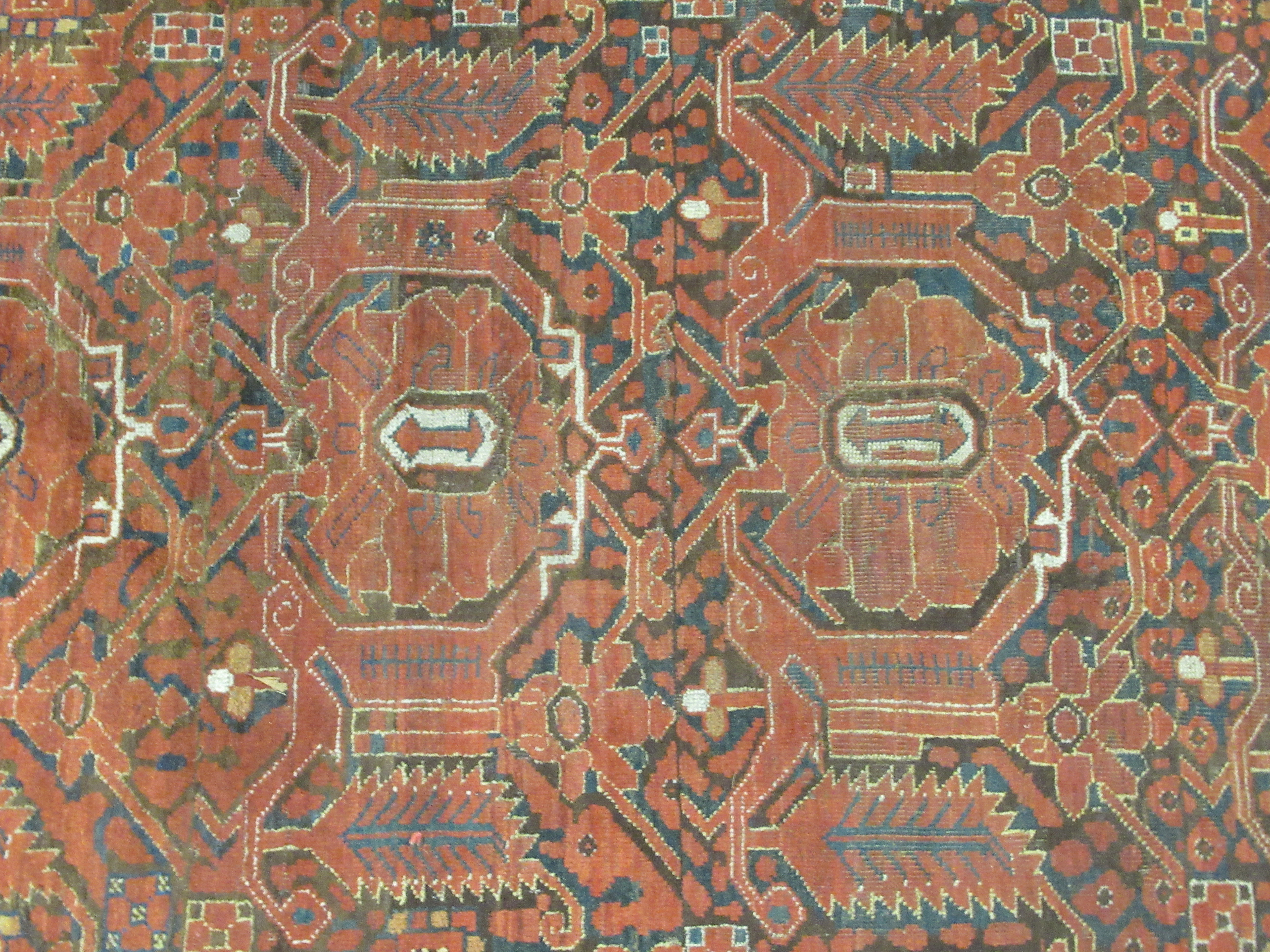 A Turkoman rug, decorated with repeating, stylised designs, on a red ground  97" x 50" - Image 2 of 5