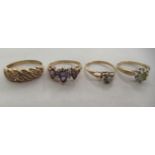 Four 10ct gold rings, variously set with coloured stones