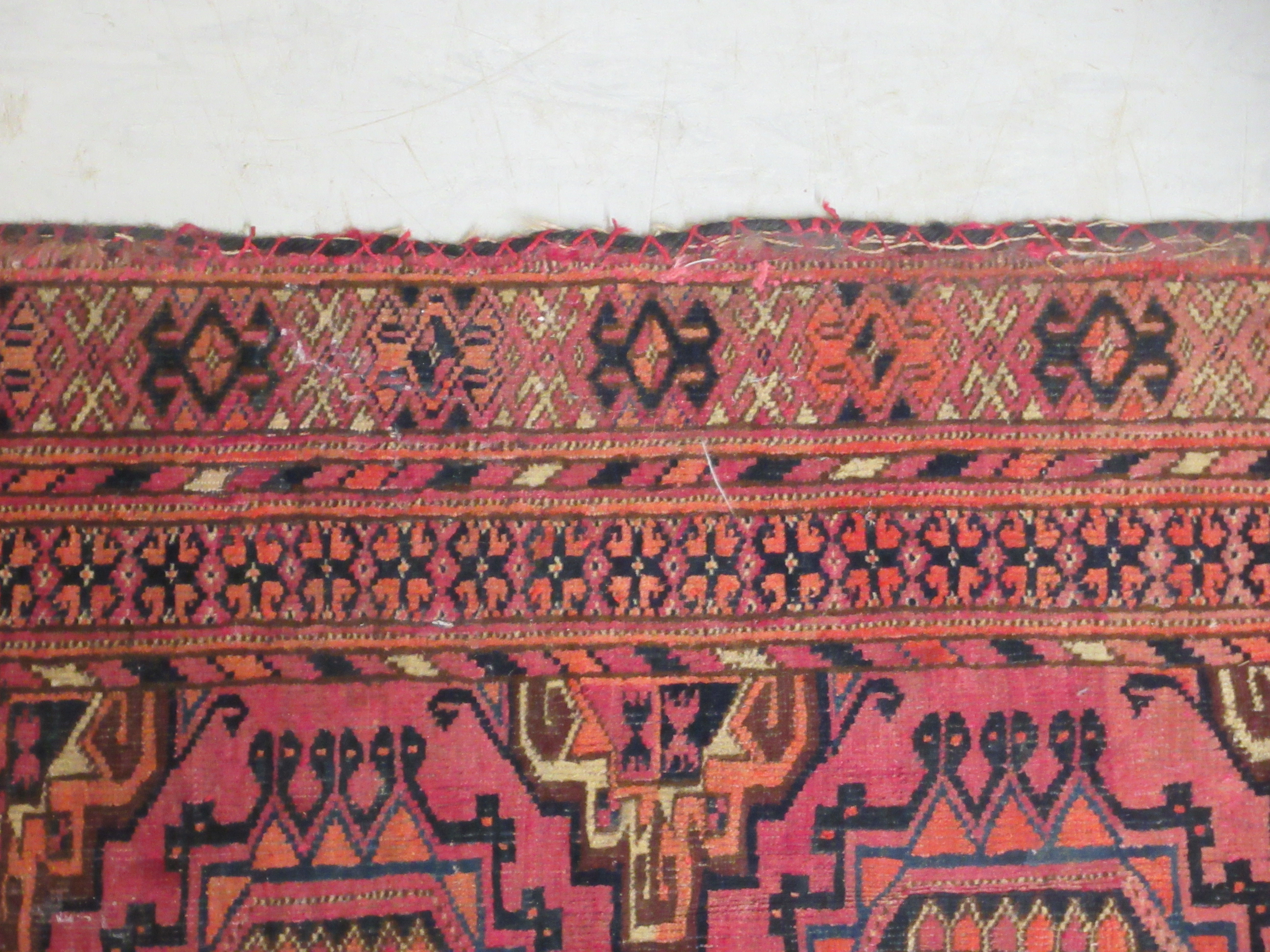 A Bokhara rug, decorated with two columns of four octagonal motifs, on a red ground  29" x 47" - Image 3 of 5