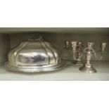 Silver plate tableware, viz. a pair of twin branch candelabra  7"h  10"w; and a meat dome, on an