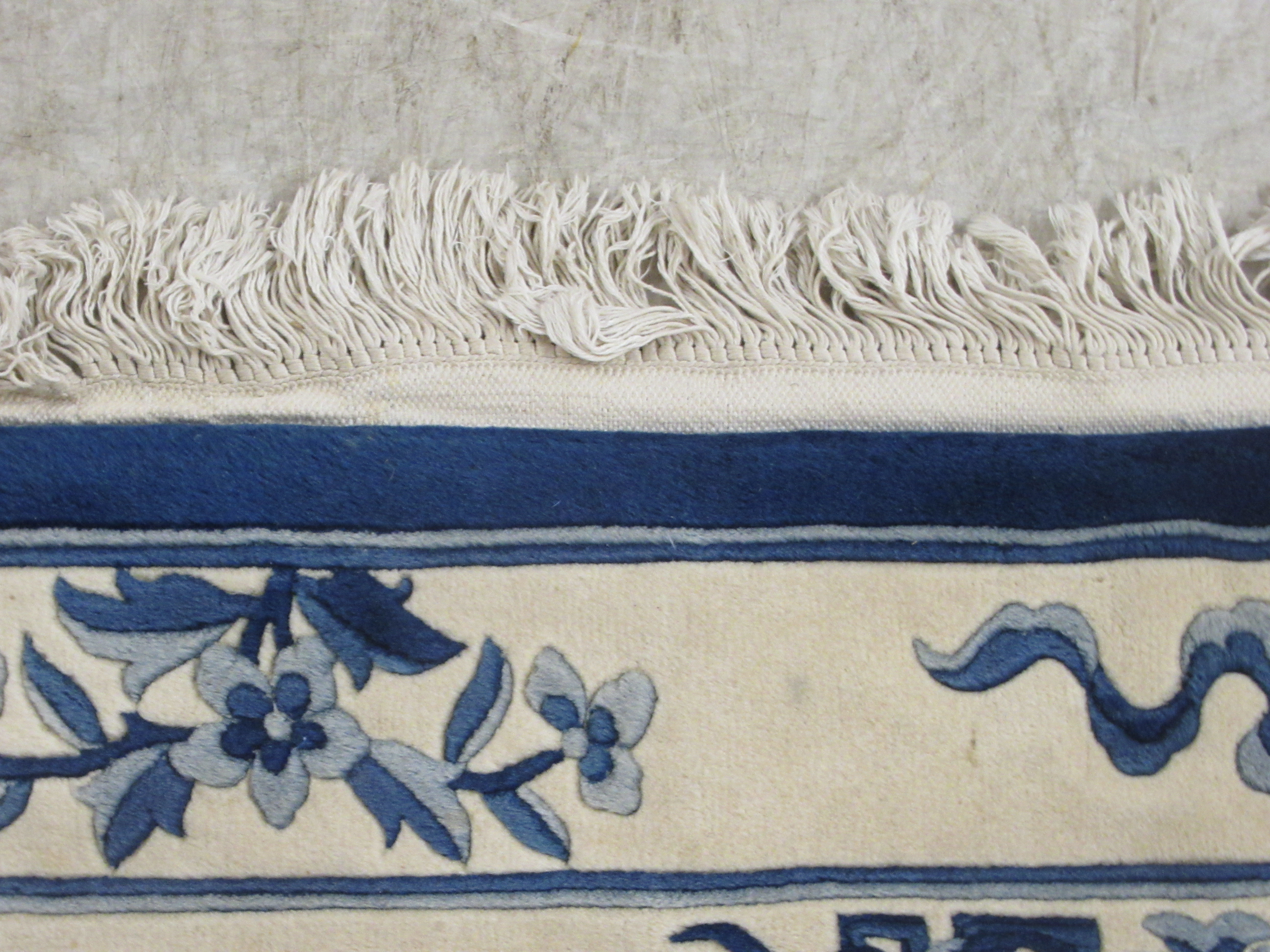 A modern Chinese washed woollen rug, traditionally decorated on a blue and white ground  48" x 76" - Image 3 of 5