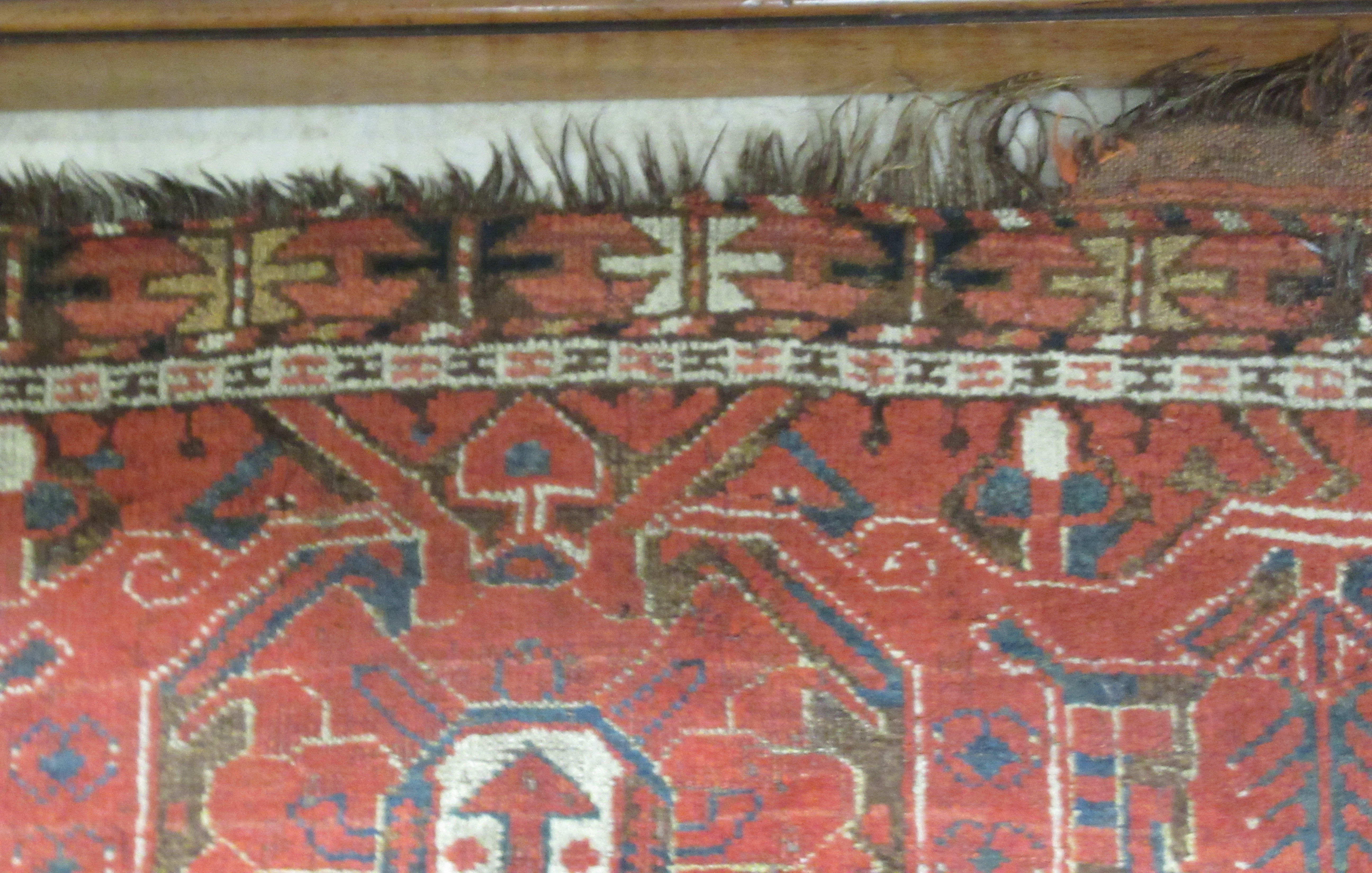 A Turkoman rug, decorated with repeating, stylised designs, on a red ground  97" x 50" - Image 4 of 5