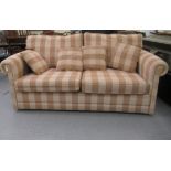 A modern cream and beige chequered fabric upholstered three person bed settee