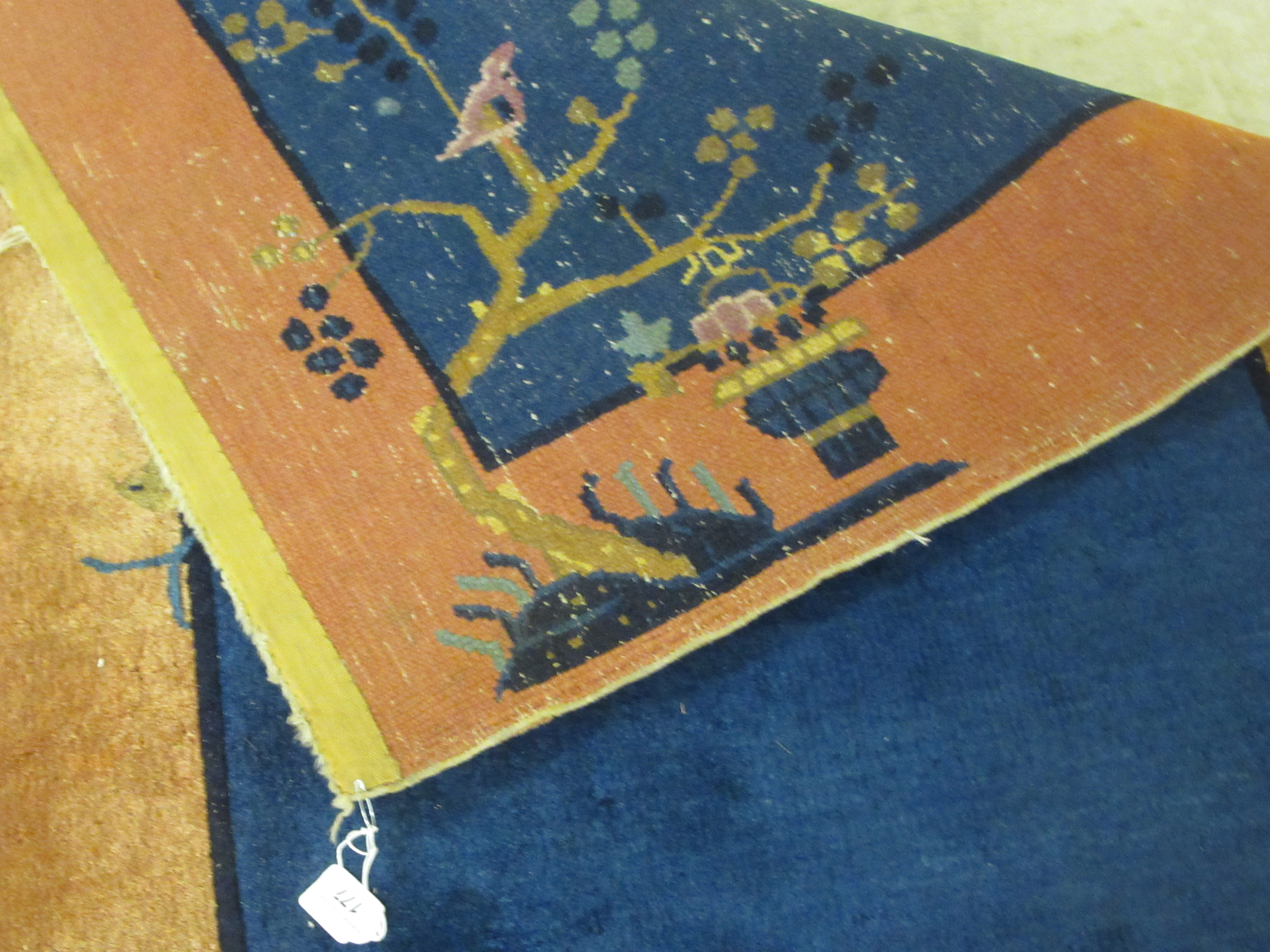 A Chinese Export woollen rug, circa 1950, decorated with a landscape on a mainly blue coloured - Image 4 of 4