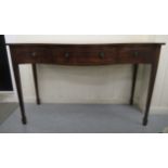 An Edwardian reproduction of a Regency satinwood inlaid mahogany serpentine front serving table with