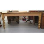 A modern pine farmhouse table, raised on turned, tapered legs  30"h  70"L