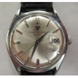 A Girard-Perregaux Gyromatic stainless steel cased wristwatch, faced by a baton dial with a date