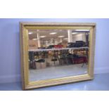 Large modern picture frame wall mirror.