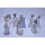 Eight assorted Nao figurines.