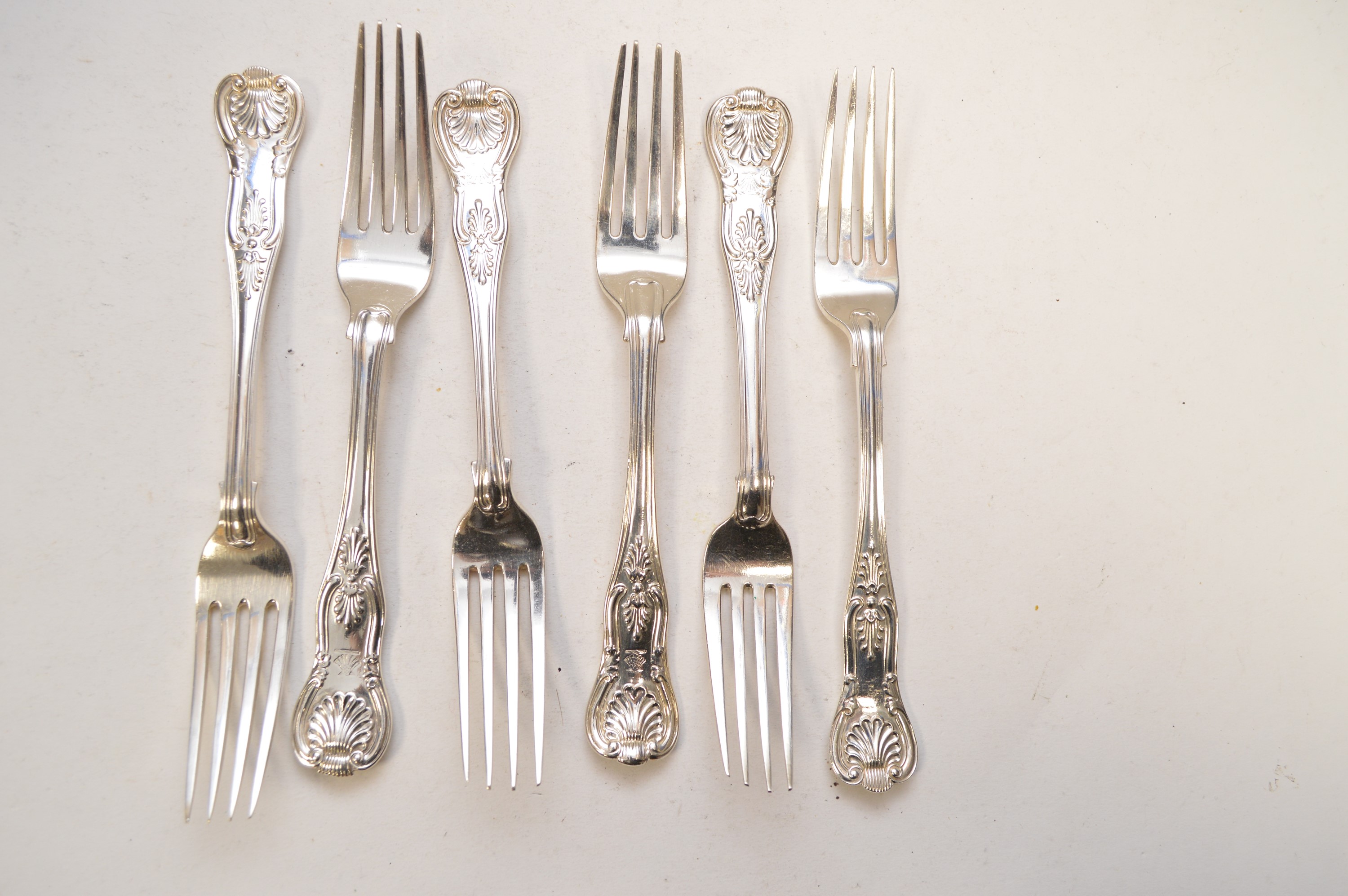 Six silver table forks