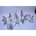 Twelve Nao ballerina figurines.