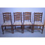 Set of four ladderback dining chairs.