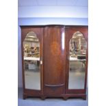 An inlaid mahogany wardrobe