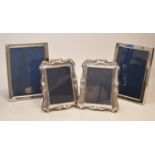 Two pairs of silver mounted photograph frames