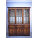 A reproduction mahogany display cabinet