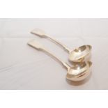 A pair of silver sauce ladles