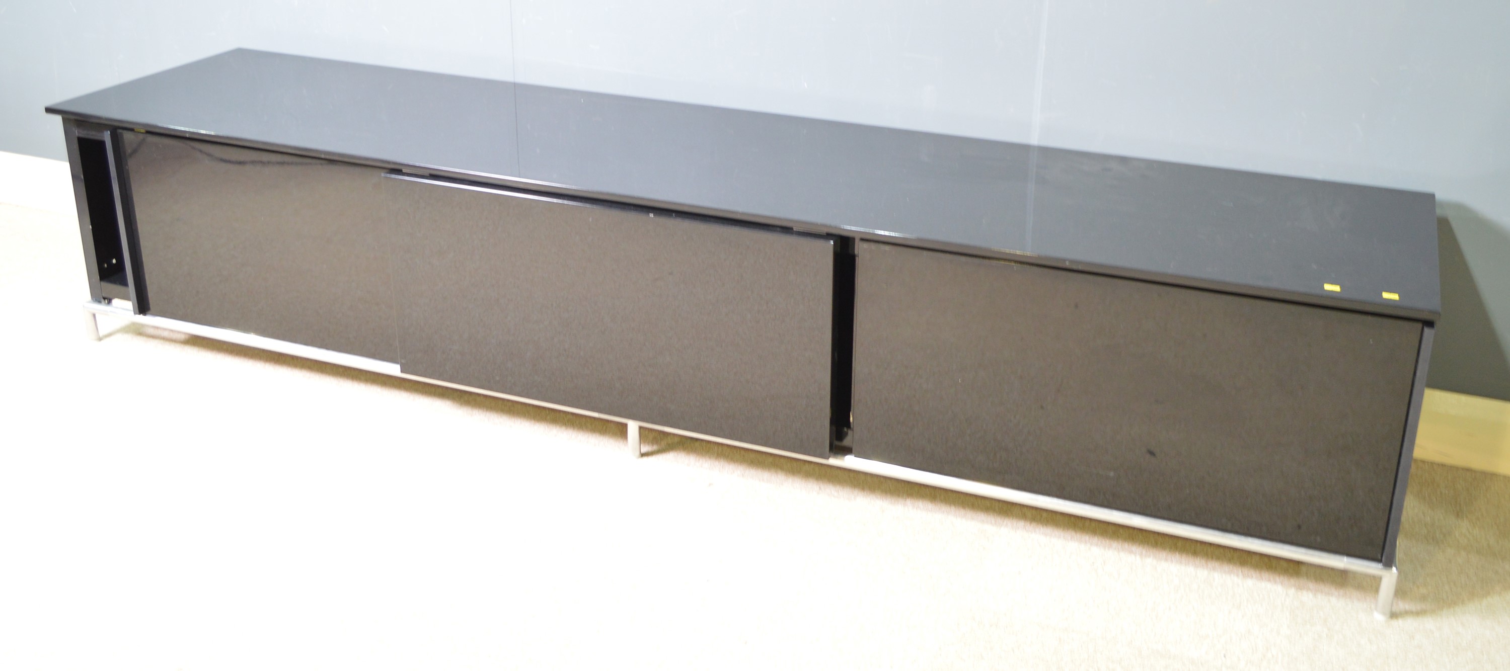 A piano black low side unit, possibly by Minotti.