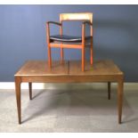 1960's teak extending dining table; and a carver chair.