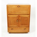 Ercol - A blonde elm secretaire/drinks cabinet