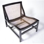 Modern canework and ebonised easy chair.