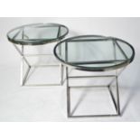 Manner of Eichholtz: a pair of chromed metal occasional tables.