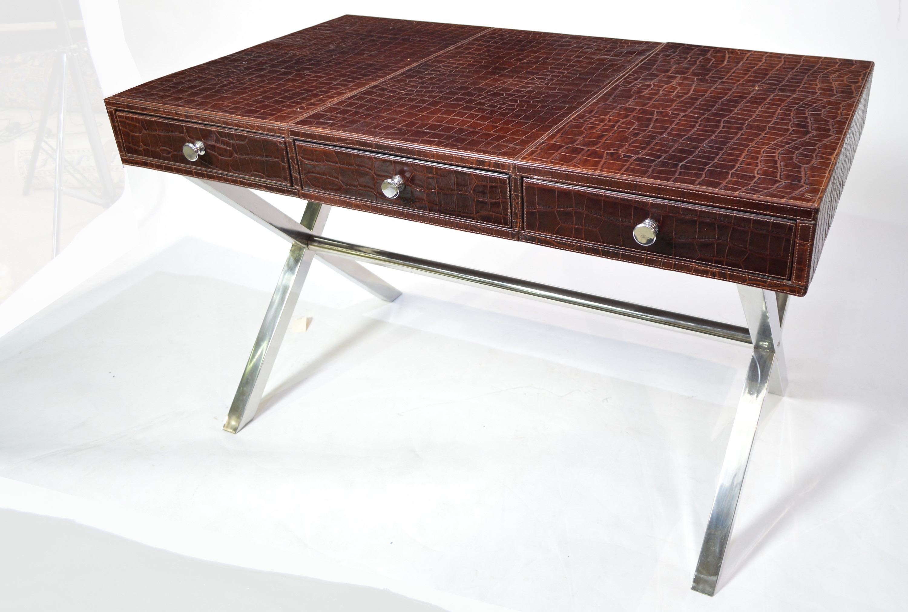 Attributed to Andrew Martin: a faux crocodile skin and chromed metal desk.