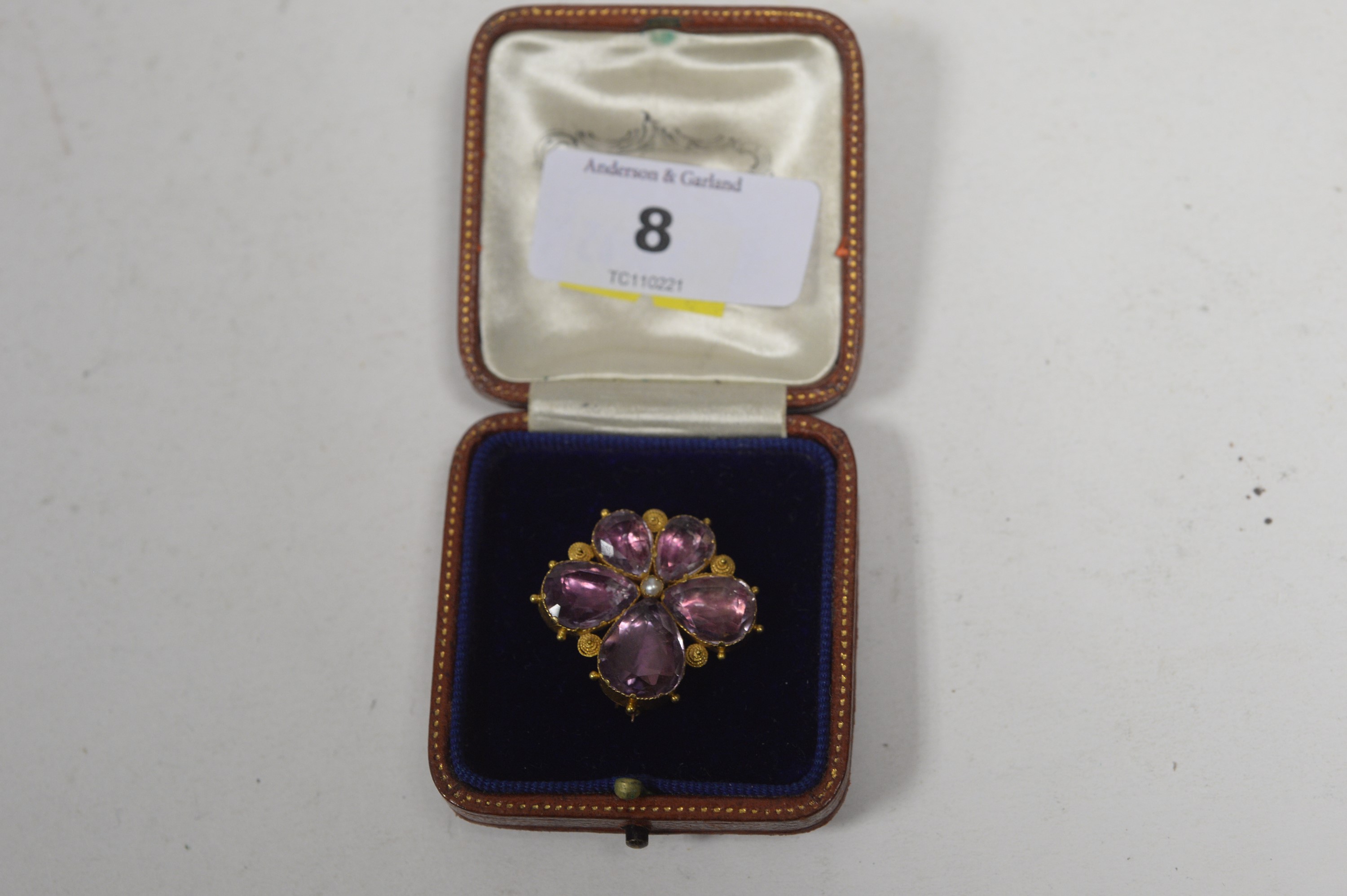 A 19th Century amethyst brooch.